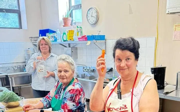 Volunteers working together in the UAFest kitchen