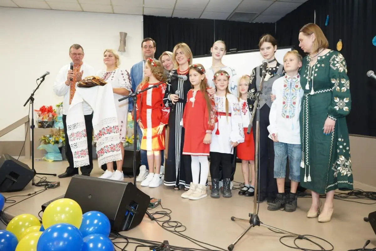 A community gathering around a korovai, the ceremonial Ukrainian bread