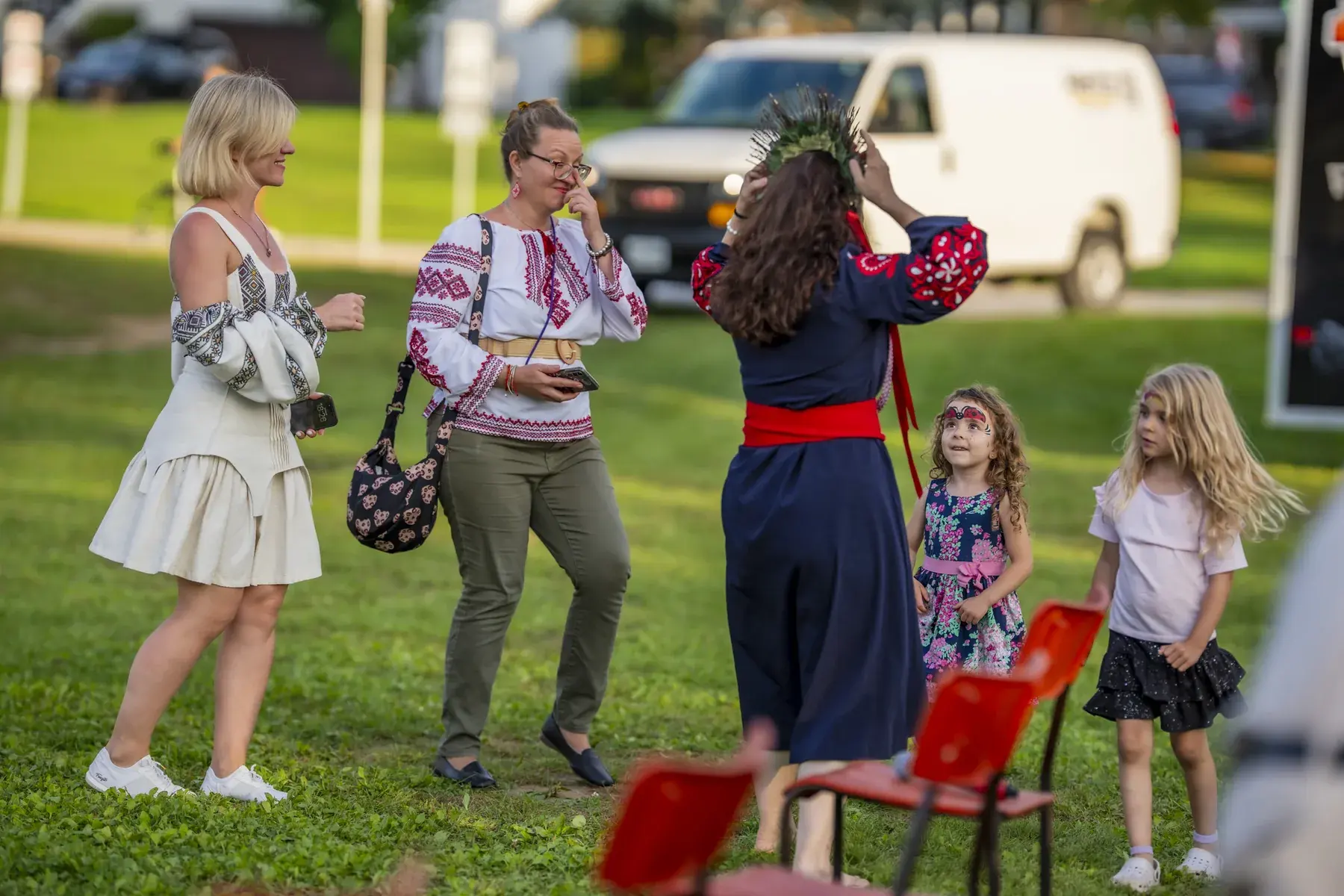 Svitlana Marchuk at UAFest 2026 — Women in embroidered clothes and little girls gather on the grass (photo: Tim Skinner)