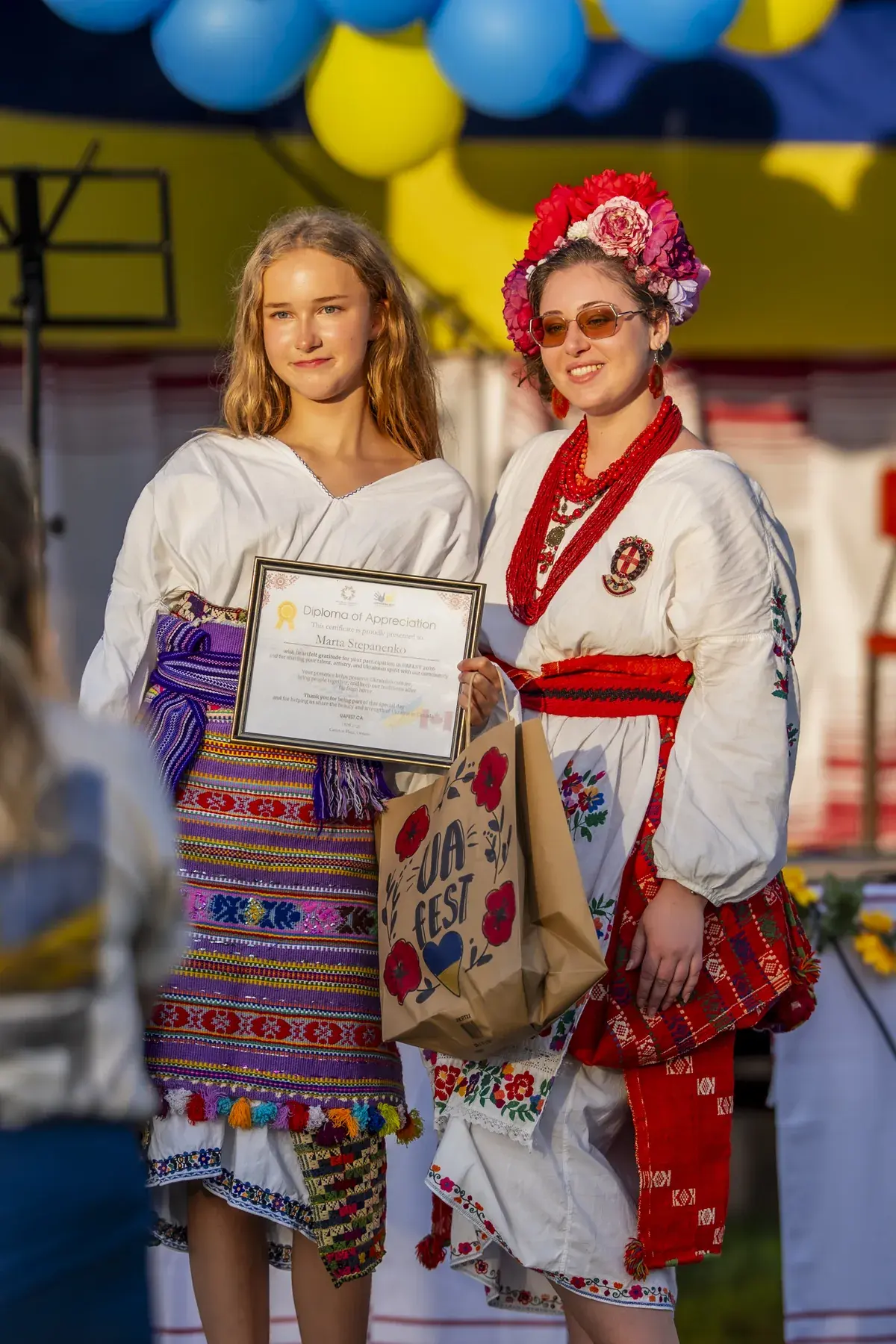 Olga Ostafiichuk at UAFest 2026 — Young singer receives a certificate of appreciation and UAFest gift bag (photo: Tim Skinner)
