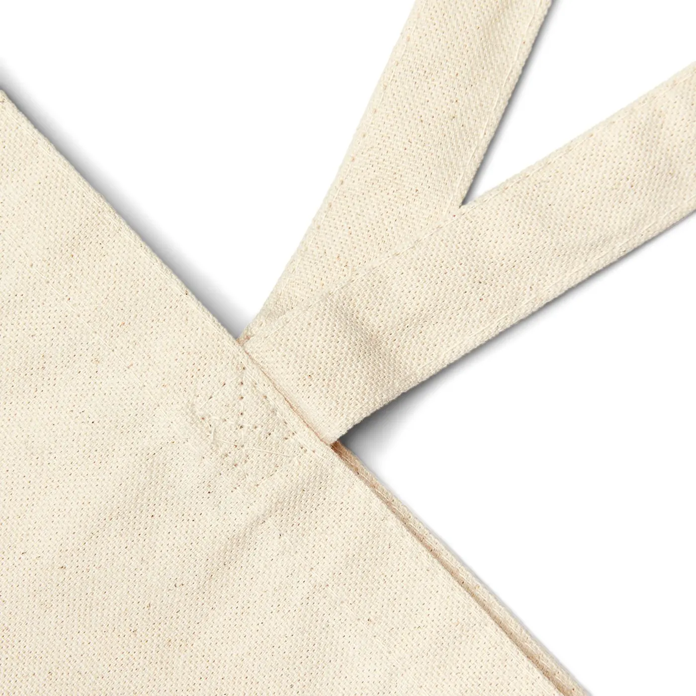 Close-up of a handle stitched onto the canvas body of the bag