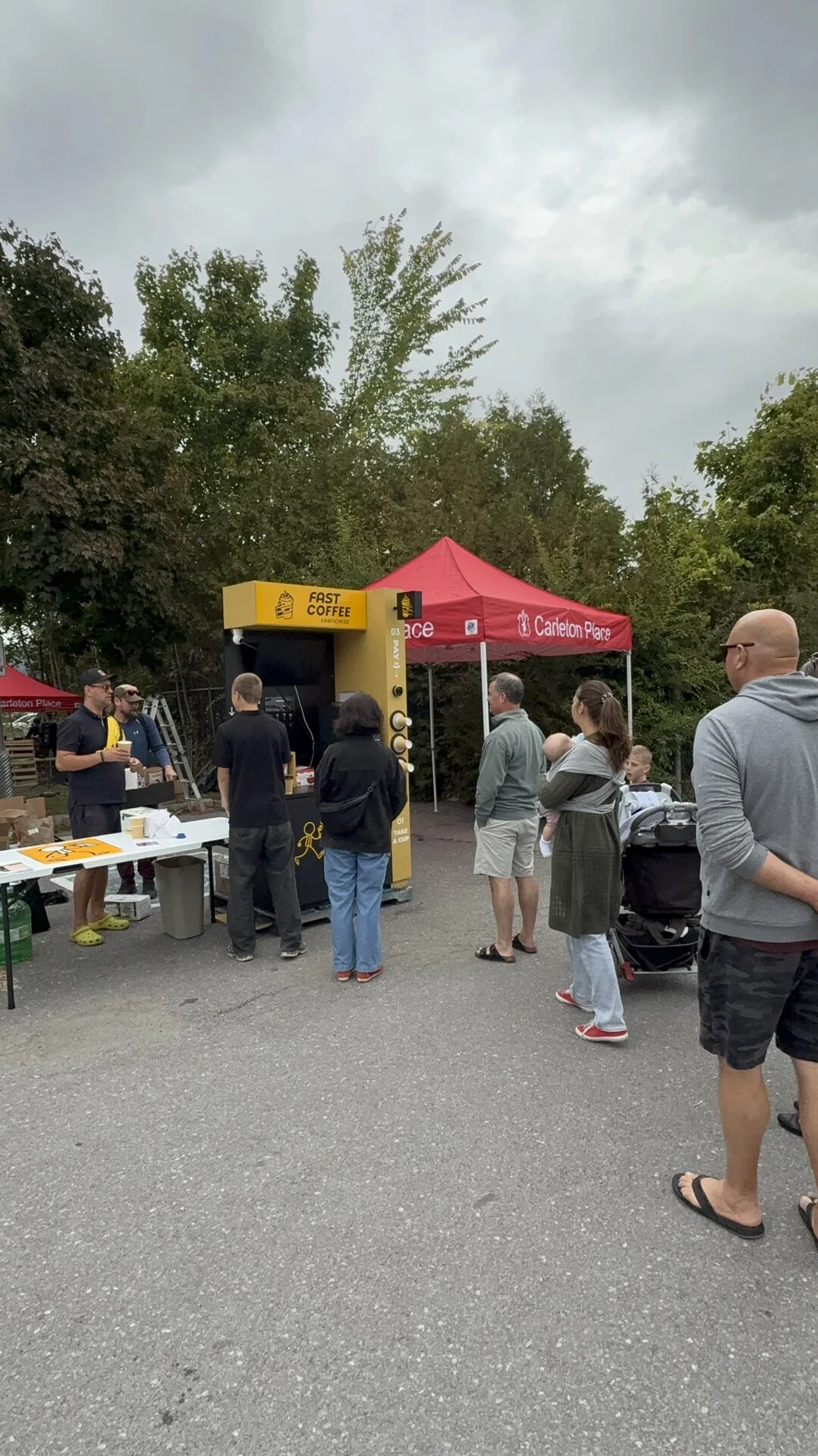 Festival guests at the Fast Coffee unit under the trees in Carleton Place, September 2025