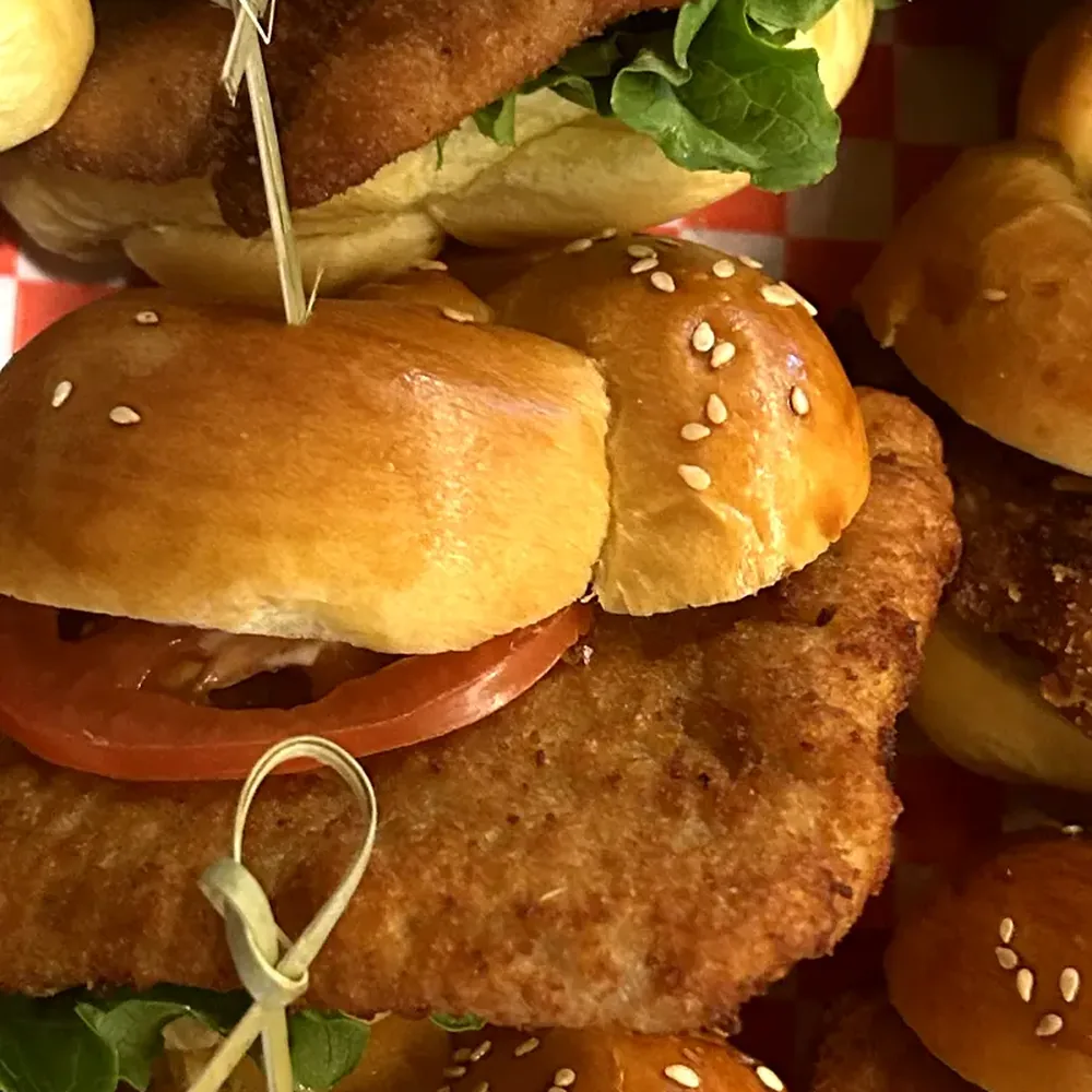 Wedel schnitzel sliders on sesame buns, skewered and stacked